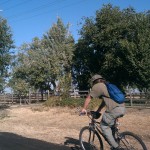 A cyclist rides westbound on Del Paso Road near Valley View Acres.