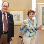 Emcee Matias Bombal with Natomas artist Diane Mattar in front of Ron Kendall's KatFlix 1 and Mattar's Paradise Palms. / Photo: Dennis Spear (N Magazine)
