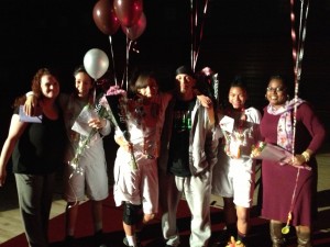 From left: Natomas High seniors Sierra Maun, Aalijah Goode and Zakari York with their parents on Senior Night. 