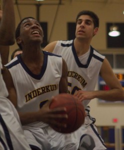 Andrew Ignont (O) grabs a rebound in front of Samer Dhillon (50).