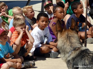 Police dog Bodie visits with Summer Oasis participatns last year. / Photo: C. Shannon