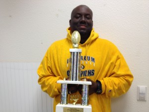 Inderkum and TMP Elite coach Terrance "Coach T" Leonard with the championship trophy. 