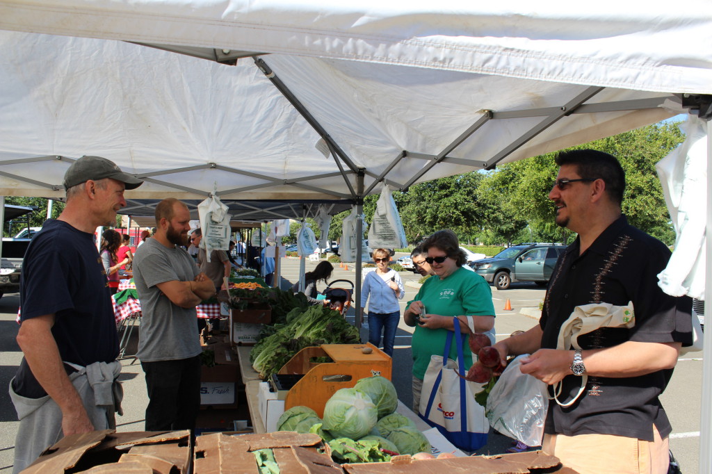 Sacramento County Supervisor Phil Serna shops at the Natomas farmers' market. 