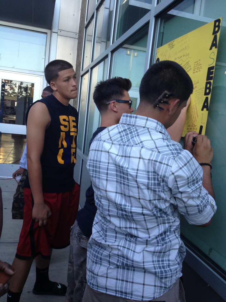 Former teammates write messages about Dylan Akins.