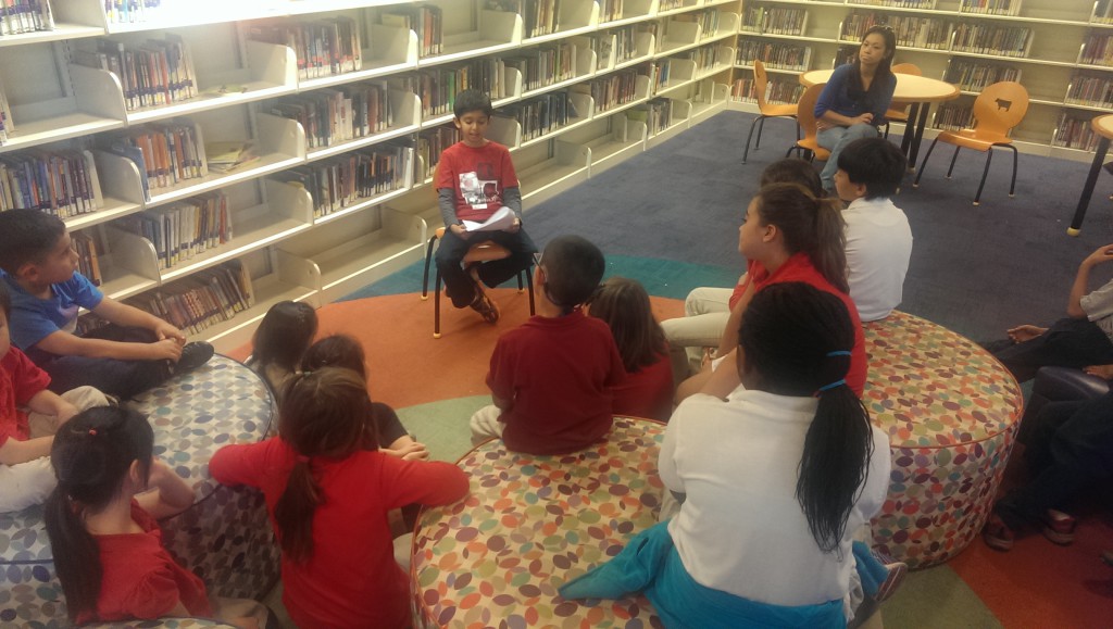 Akshaj Mehta reads to youngsters at the North Natomas Library in November.