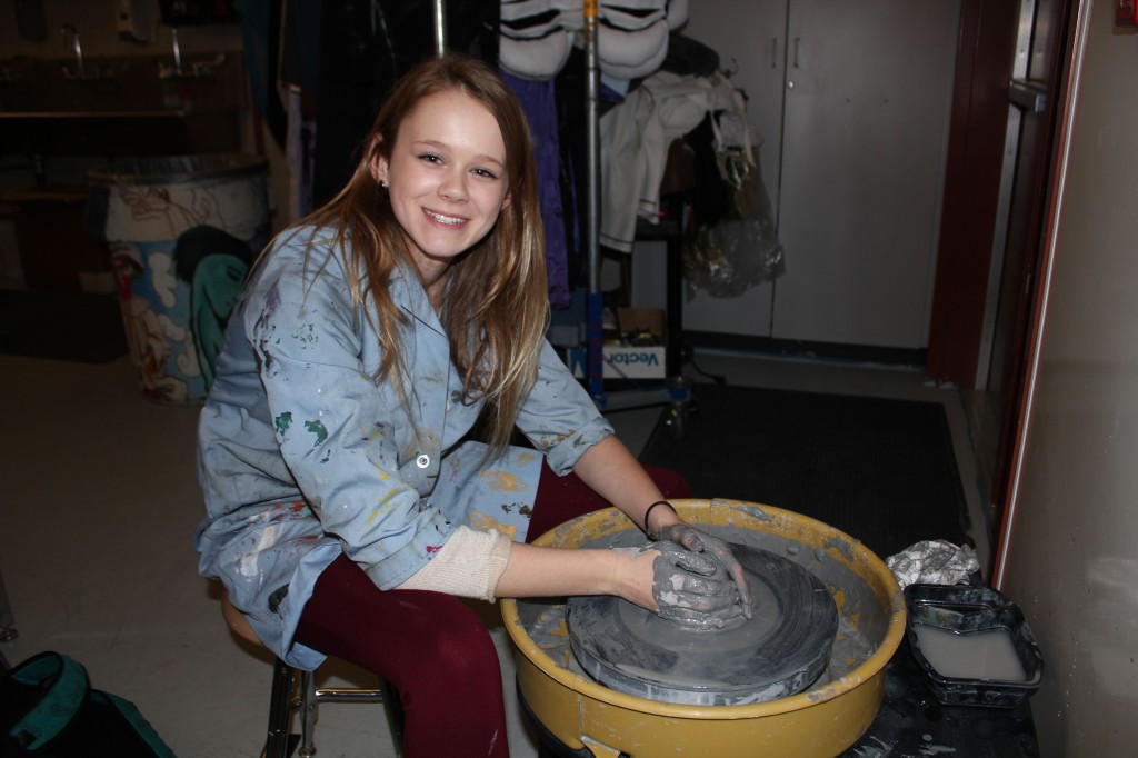 Maria Polzin works with clay on a potters wheel (2013).