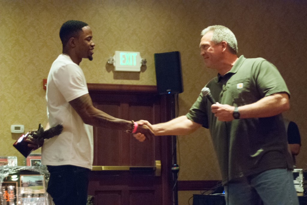 Miami Dolphins wide receiver Marlon Moore with former coach Terry Stark. / Photo by Jeremiah McWright, NHS intern