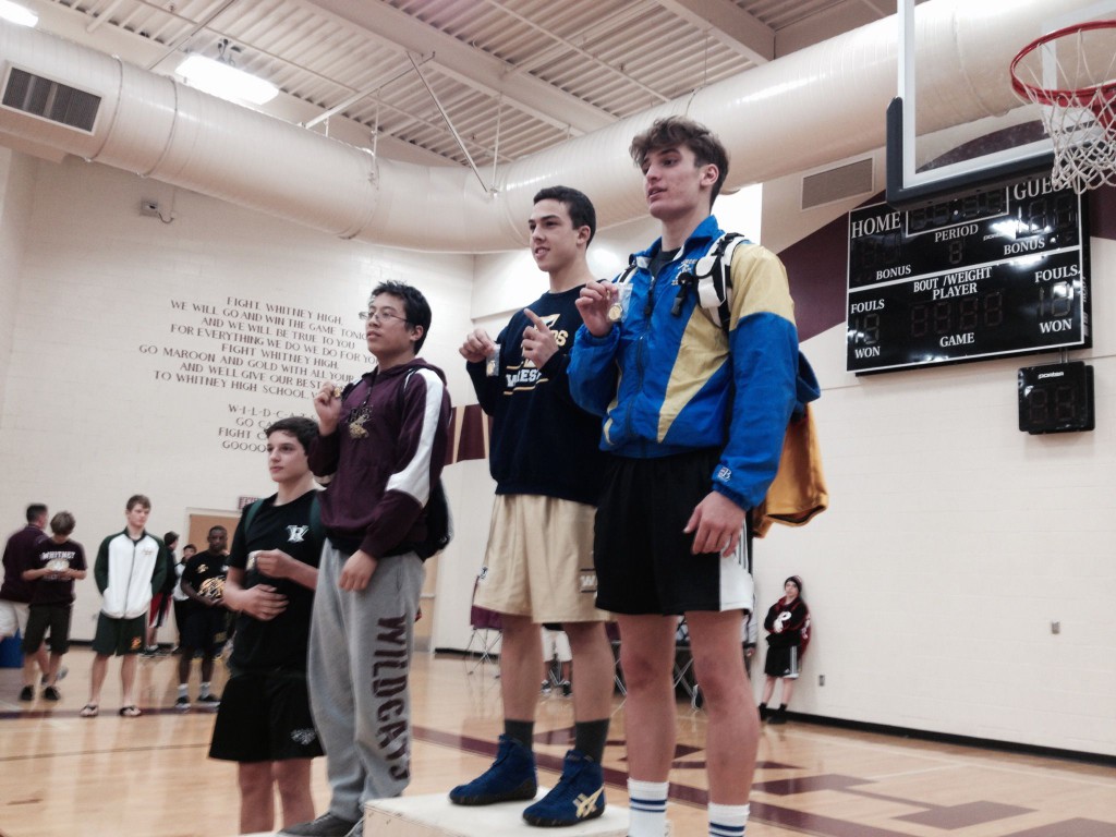 Nicko Chapman, Inderkum sophomore at 152 pounds, stands on the podium as the Sac-Joaquin Section Division III champion on Saturday at Whitney High School in Rocklin. / Photo: T. Horn