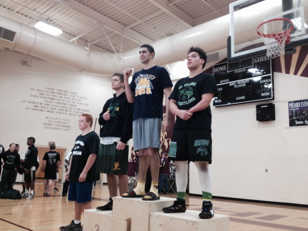Isaac Mendoza, Inderkum junior at 220 pounds, stands on the podium as the Sac-Joaquin Section Division III champion on Saturday at Whitney High School in Rocklin. / Photo: T. Horn