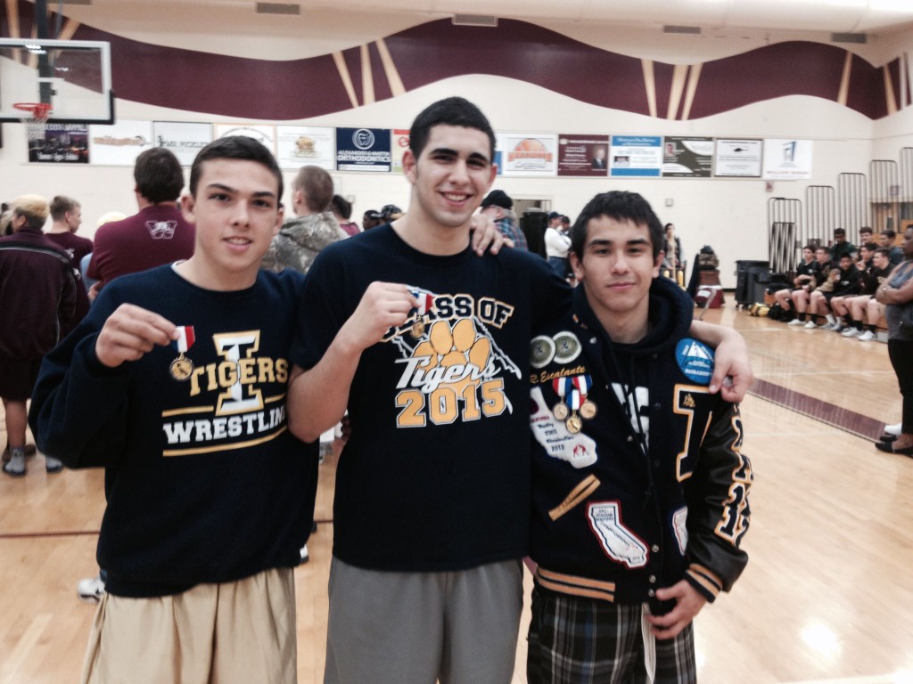 From left, Nicko Chapman (152 pounds), Isaac Mendoza (220) and Ruben Escalante (126) show off their DIII medals as all three become the first Inderkum Divisional champions in school history. / Photo: T. Horn