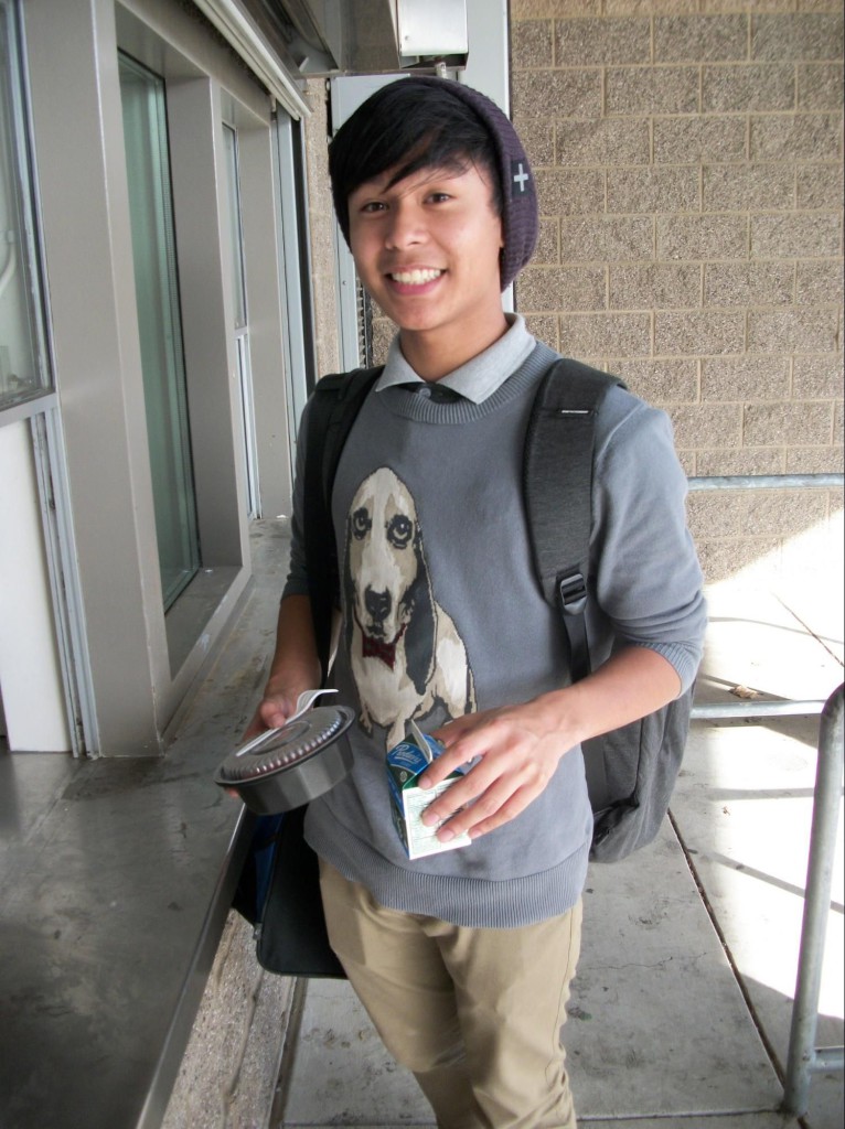 Inderkum sophomore Kenneth Aquino picking up a free meal after school before heading to Jazz rehearsal. / Photo: V. Carrillo