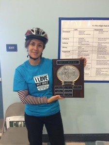 Mellissa Meng shows off the May is Bike Month school plaque.