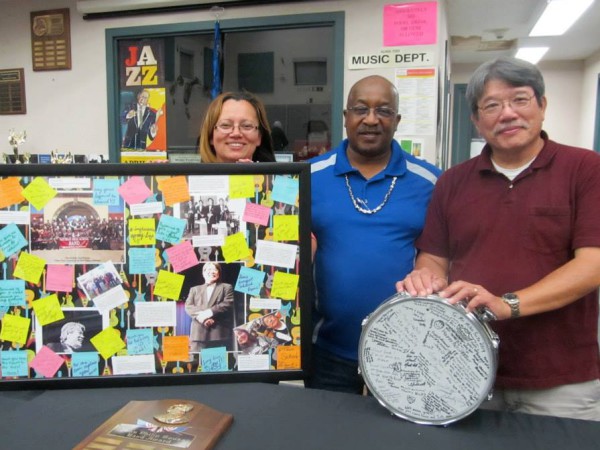 NHS Band Booster President Eddy Kennedy, Floyd Kennedy present Mike Seto with some personalized gifts honoring him on his retirement.  / Courtesy Photo