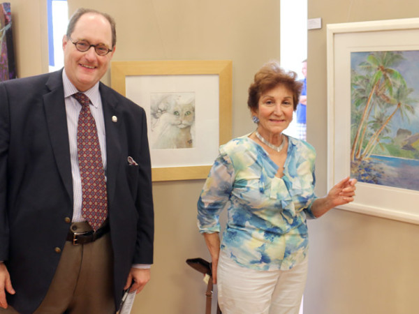 Emcee Matias Bombal with Natomas artist Diane Mattar in front of Ron Kendall's KatFlix 1 and Mattar's Paradise Palms. / Photo: Dennis Spear (N Magazine)