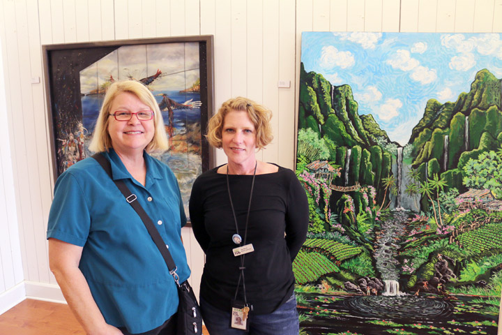 Karen Thomas, North Natomas Friends of the Library and Suzy Murray, North Natomas Library in front of  Ron Kendall's "Water Sign" and Jamie F. Acosta's "Water Hole" / Photo: Dennis Spear (N Magazine)