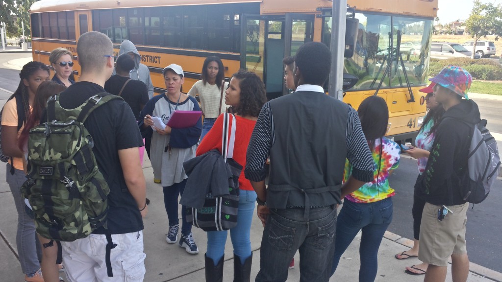 School staff organize students transported to Sleep Train Arena as part of flood evacuation scenario.