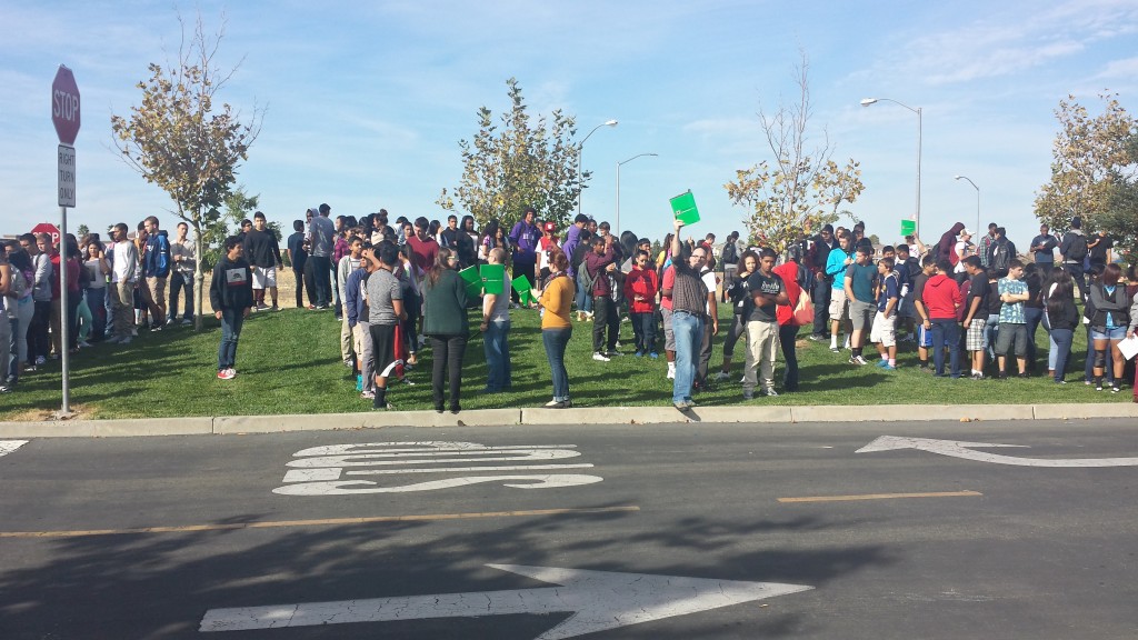 Students congregate in the Inderkum High School parking lot as part of an earthquake safety drill on Thursday. 