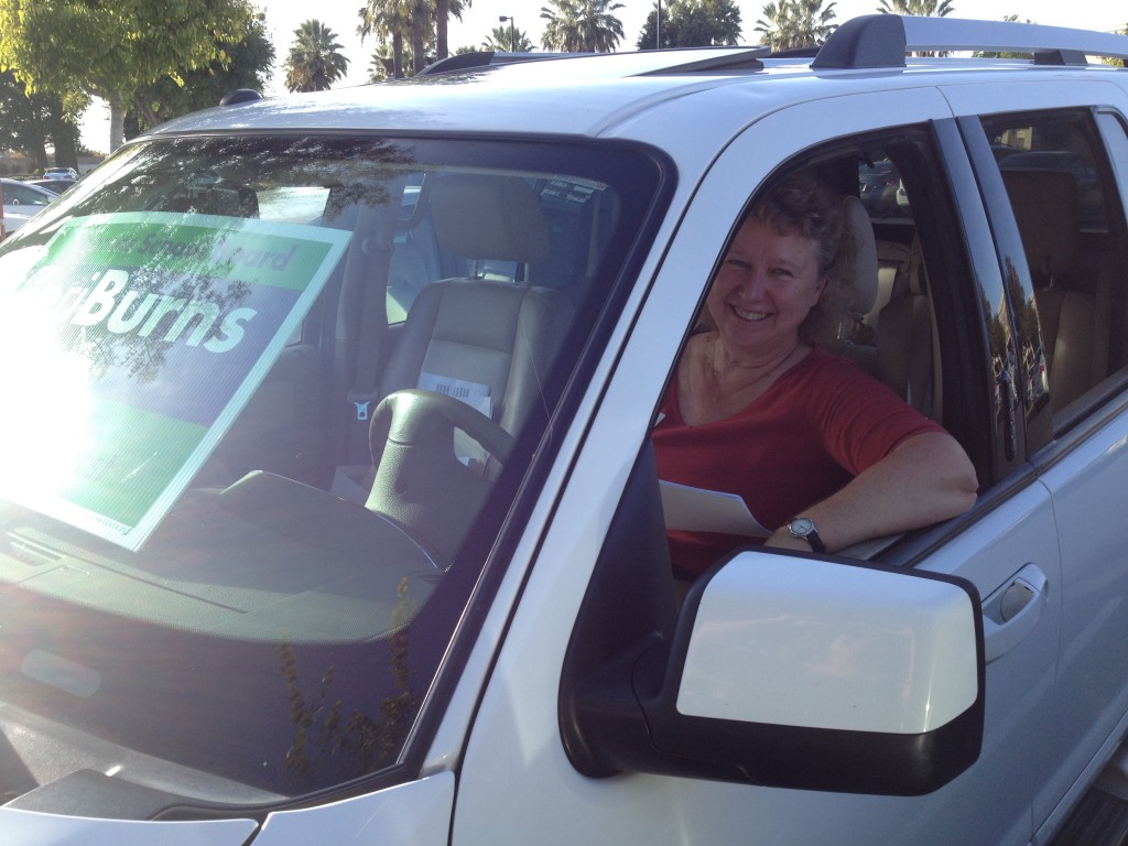 School board candidate takes a break from walking precincts Monday to catch up on phone calls in the Raley's parking lot. / Photo: BTB