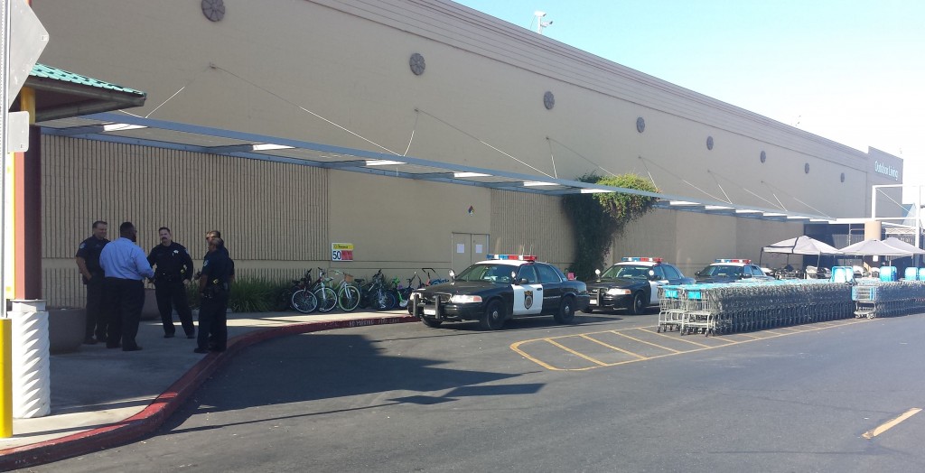 Walmart General Manager Franklin Jackson speaks with Sacramento Police shortly after bomb threat at the store. / Photo: Marc Laver