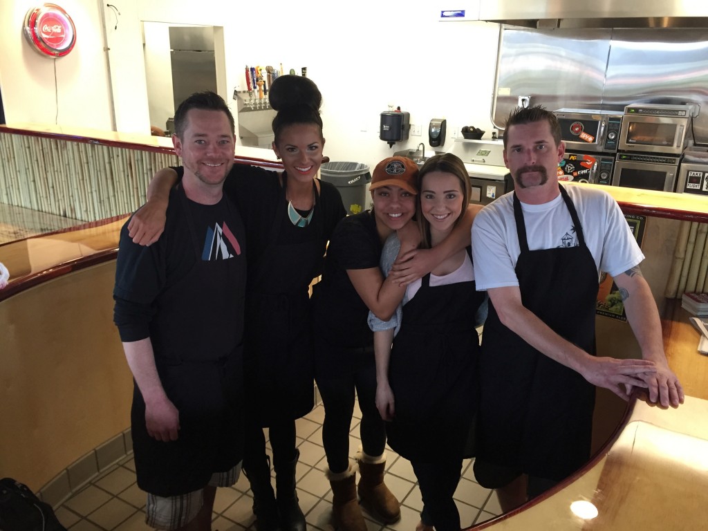 Beach Hut Deli employees behind  the eatery's new bamboo bar.