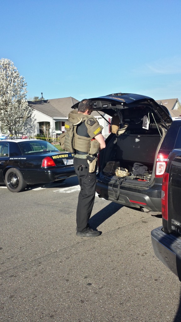 SWAT officers gear up on scene at Bridgecross Way. / Photo: Marc Laver NatomasBuzz.com