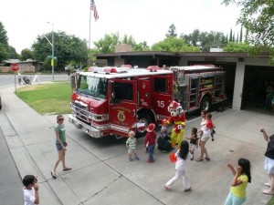 Image of the fire station with a fire engine parked in the driveway.