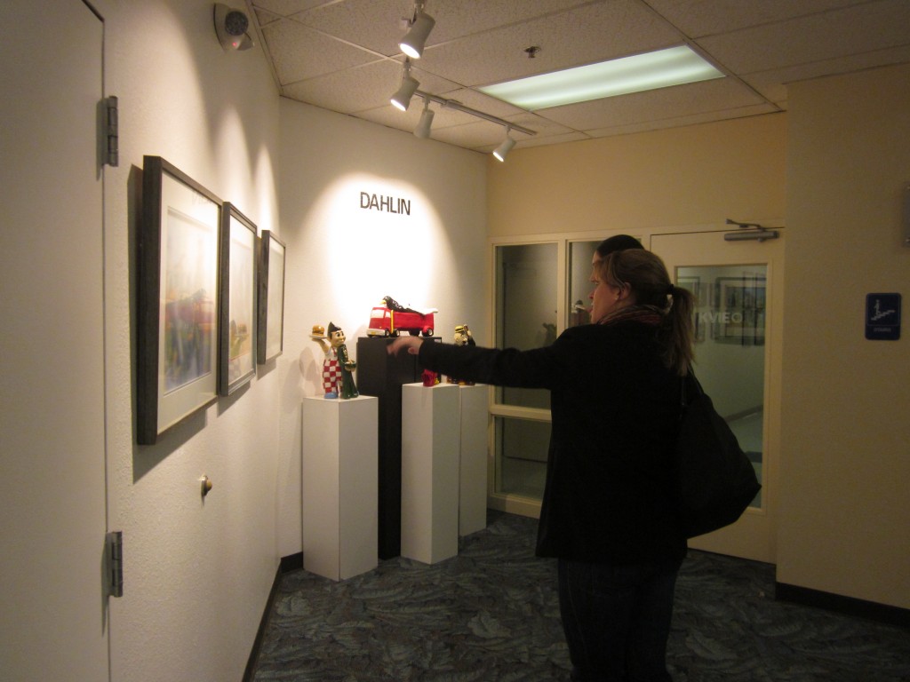 Visitors viewing Sandy Lindblad's horse portraits. Photo: Sandy Thomas