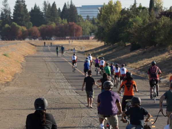 ocal cycling enthusiasts including those from the Heritage Park Bike Club and students from local North Natomas schools, immediately embarked on the trail on foot, bike or scooter after the ceremony concluded. / Photo: NNTMA