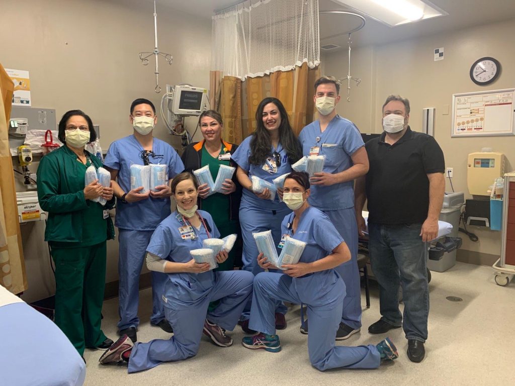 Group photos of healthcare workers all wearing surgical masks and some holding packages containing donated masks.