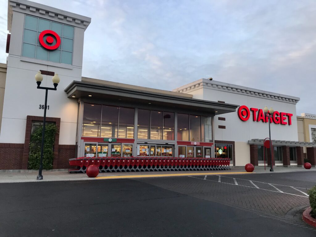 Image of the Target storefront in Natomas. Shopping carts are lined up against the outside of the store's doors.