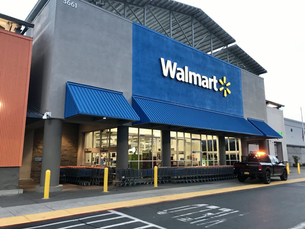 Image of Walmart storefront in Natomas with shopping carts barricading the outer doors.