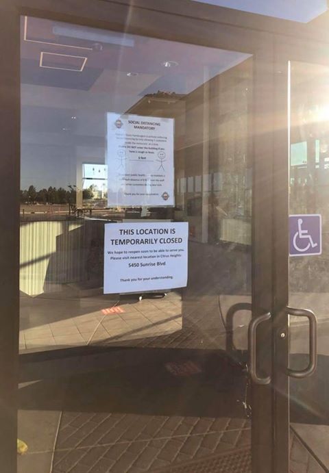 Image of sign on class door with closure notification.