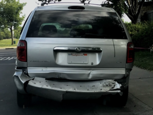 Image of damaged mini van.