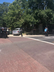 Image of vehicle surrounded by cinder blocks from wall it crashed through.