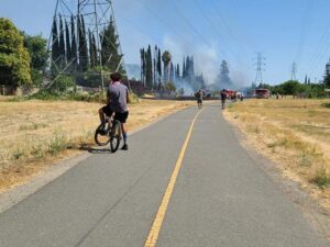 Image of bike trail with smoke on horizon.