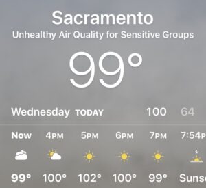 Image of weather app showing gray skies and unhealthy air quality conditions.