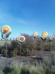 Image of sunflower like sculptures.