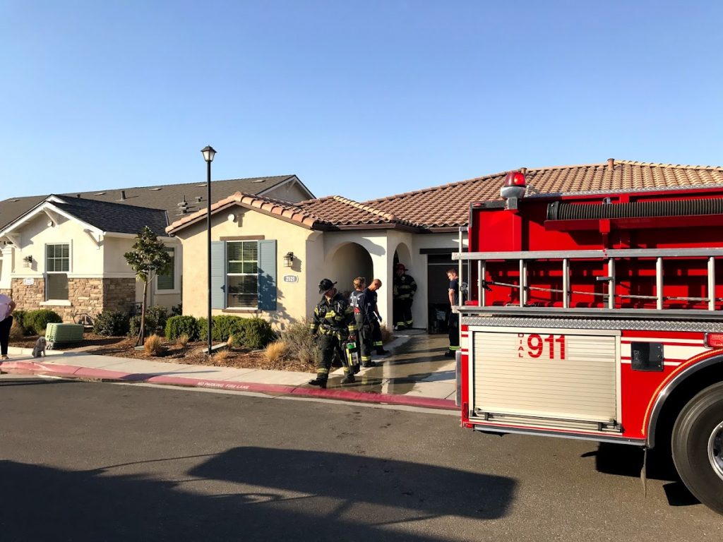 Image of firetruck partially blocking garage.