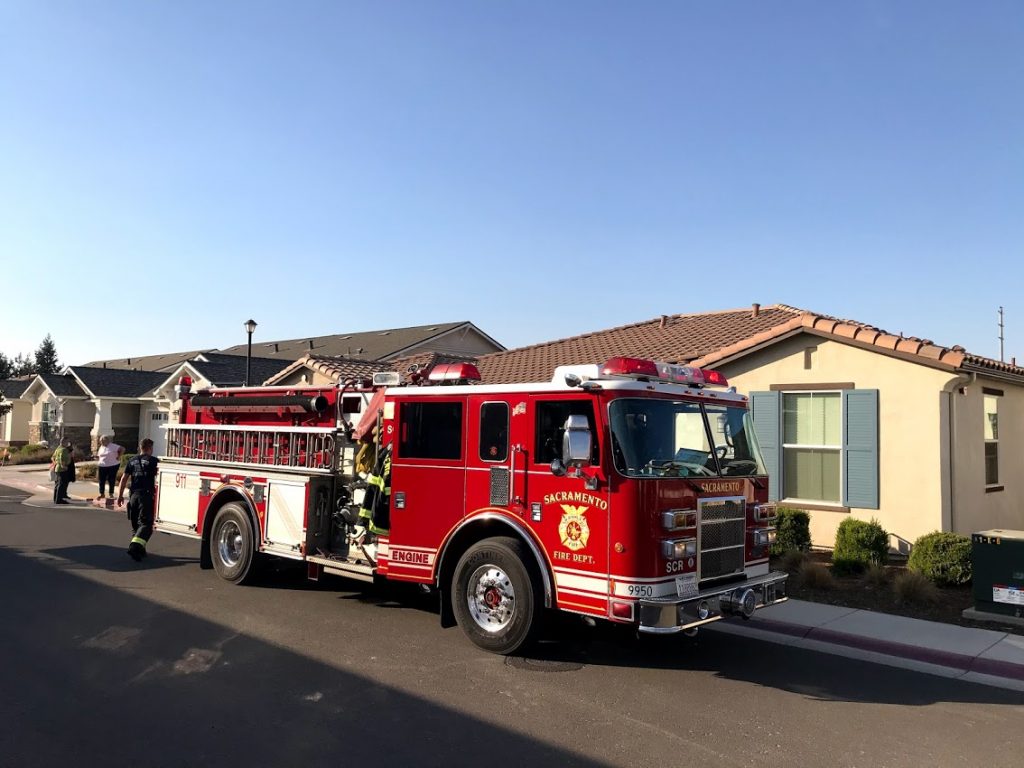 Image of fire truck in front of home.