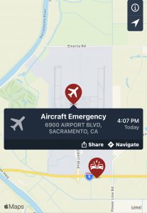 Image of airplane on map with words aircraft emergency.