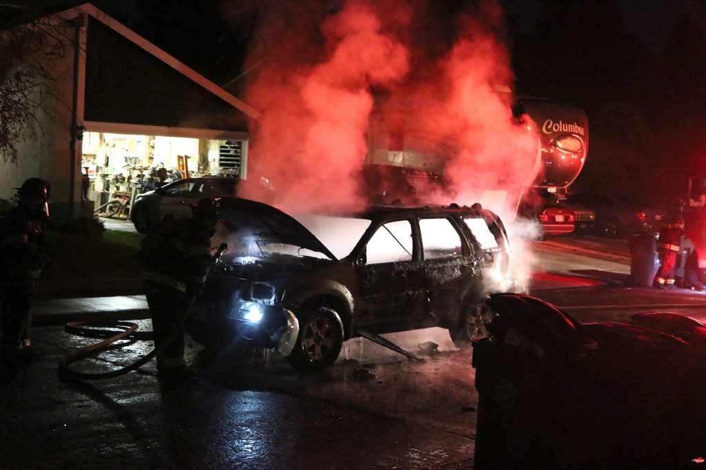 Image of vehicle engulfed in flames.