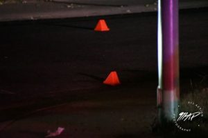 Image of orange evidence cones on the street.