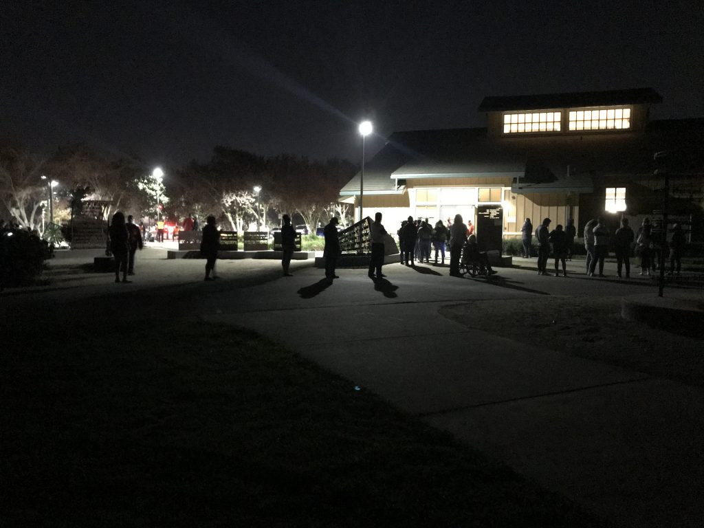 Image of silhouette of people in line on Election Day.