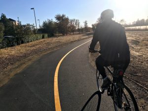 Image of rider on new Natomas bike trail.