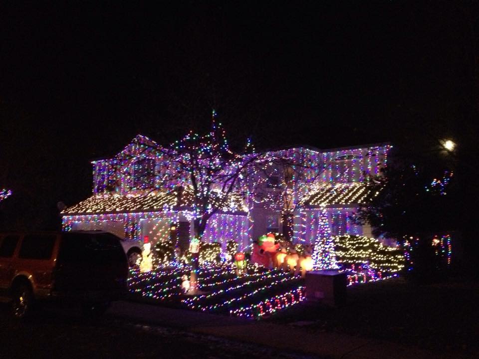 Image of house decorated with lights for the holidays.