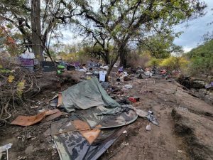 Image of trash and debris covering the ground.