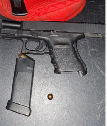 Image of gun and a ammunition cartridge.